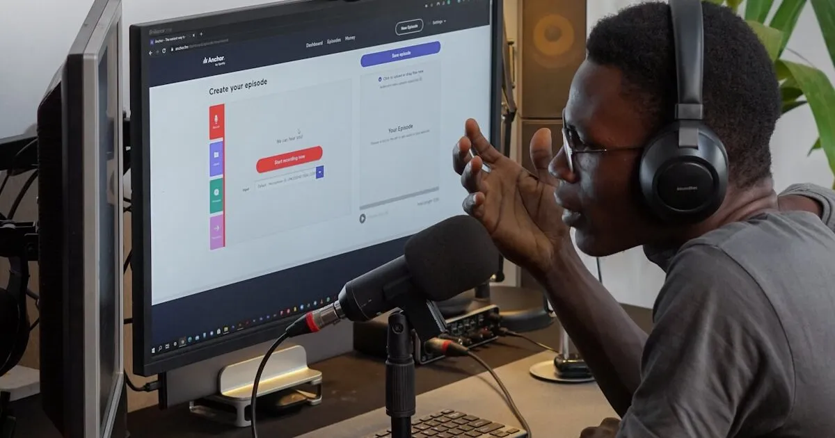 Creative writing workspace with laptop in dark setting